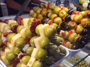 Pimento pepper , cheese, sun dried-tomato stuffed olives on a skewer!